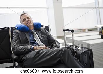 Picture - businessman sleeping 
in waiting area. 
fotosearch - search 
stock photos, 
pictures, images, 
and photo clipart