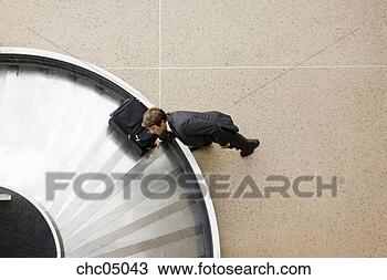 Stock Photo - businessman taking 
suitcase from 
baggage claim. 
fotosearch - search 
stock photos, 
pictures, images, 
and photo clipart
