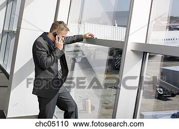 Stock Photography - businessman talking 
on cell phone. 
fotosearch - search 
stock photos, 
pictures, images, 
and photo clipart