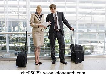 Stock Photograph - businesspeople 
looking at paperwork. 
fotosearch - search 
stock photos, 
pictures, images, 
and photo clipart