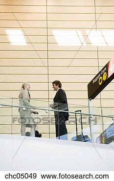 Stock Photograph - businesspeople 
next to airport 
sign. fotosearch 
- search stock 
photos, pictures, 
images, and photo 
clipart