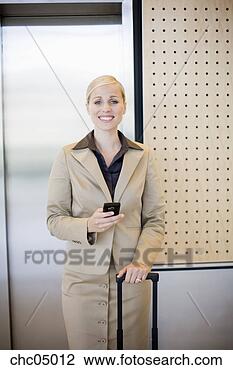 Stock Photo - businesswoman 
holding cell phone. 
fotosearch - search 
stock photos, 
pictures, images, 
and photo clipart