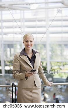 Stock Photo - businesswoman 
holding cell phone. 
fotosearch - search 
stock photos, 
pictures, images, 
and photo clipart