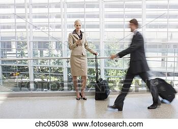 Stock Photo - businesswoman 
looking at cell 
phone. fotosearch 
- search stock 
photos, pictures, 
images, and photo 
clipart