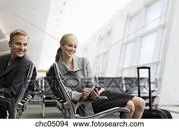 Stock Photo - businesswoman 
looking at cell 
phone. fotosearch 
- search stock 
photos, pictures, 
images, and photo 
clipart