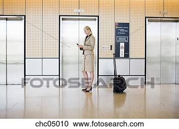 Stock Photography - businesswoman 
next to suitcase. 
fotosearch - search 
stock photos, 
pictures, images, 
and photo clipart