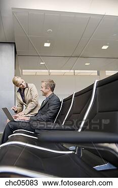 Stock Photo - businesswoman 
pointing to businessman’s 
laptop. fotosearch 
- search stock 
photos, pictures, 
images, and photo 
clipart
