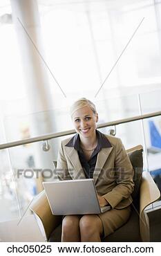 Stock Image - businesswoman 
typing on laptop. 
fotosearch - search 
stock photos, 
pictures, images, 
and photo clipart