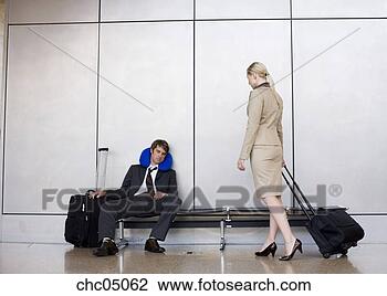 Stock Photo - businesswoman 
watching businessman 
sleep on bench. 
fotosearch - search 
stock photos, 
pictures, images, 
and photo clipart
