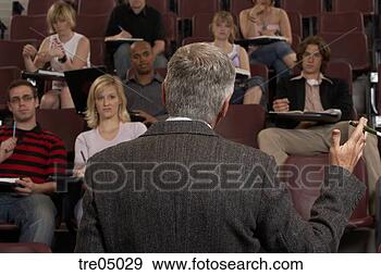 Stock Photograph - older man teaching 
in auditorium 
full of young 
students. fotosearch 
- search stock 
photos, pictures, 
images, and photo 
clipart