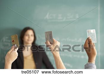 Picture - students holding 
credit cards in 
the air. fotosearch 
- search stock 
photos, pictures, 
images, and photo 
clipart