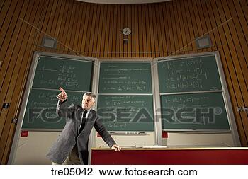 Stock Photo - teacher in front 
of blackboard. 
fotosearch - search 
stock photos, 
pictures, images, 
and photo clipart