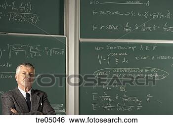 Stock Photo - teacher in front 
of blackboard. 
fotosearch - search 
stock photos, 
pictures, images, 
and photo clipart