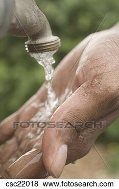 Stock Photo - african man washing 
his hands. fotosearch 
- search stock 
photos, pictures, 
images, and photo 
clipart
