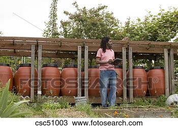 Stock Photo - man checking clipboard 
outdoors. fotosearch 
- search stock 
photos, pictures, 
images, and photo 
clipart