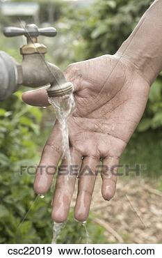 Stock Photograph - man washing his 
hands. fotosearch 
- search stock 
photos, pictures, 
images, and photo 
clipart
