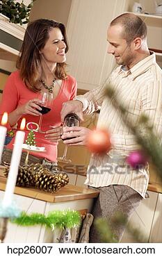 Picture - couple drinking 
red wine in the 
kitchen. fotosearch 
- search stock 
photos, pictures, 
images, and photo 
clipart