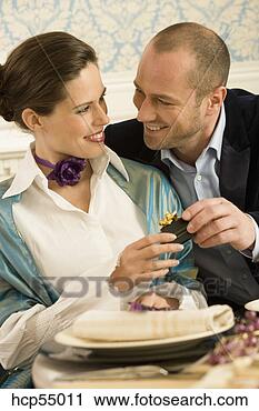 Stock Photography - man giving girlfriend 
gift. fotosearch 
- search stock 
photos, pictures, 
images, and photo 
clipart