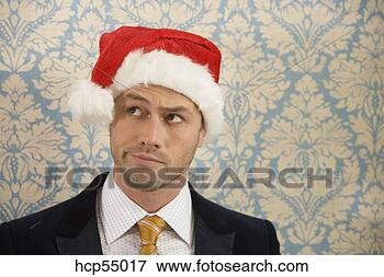 Picture - man wearing santa 
hat. fotosearch 
- search stock 
photos, pictures, 
images, and photo 
clipart