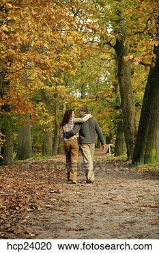 Stock Photography - couple walking 
in the woods. 
fotosearch - search 
stock photos, 
pictures, images, 
and photo clipart