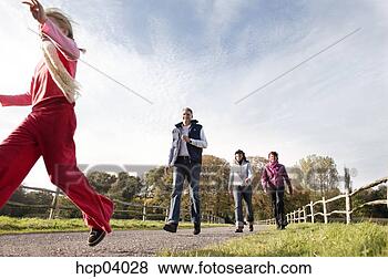 Stock Photo - family running 
outside. fotosearch 
- search stock 
photos, pictures, 
images, and photo 
clipart