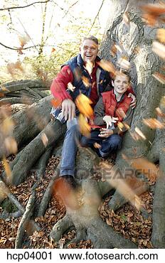 Stock Photography - father and son 
throwing leaves. 
fotosearch - search 
stock photos, 
pictures, images, 
and photo clipart