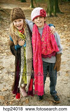 Stock Photo - girl and boy in 
winter scarves 
and caps. fotosearch 
- search stock 
photos, pictures, 
images, and photo 
clipart