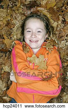 Stock Photography - girl laying in 
autumn leaves. 
fotosearch - search 
stock photos, 
pictures, images, 
and photo clipart