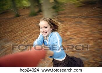 Stock Photo - girl twirling 
in the woods. 
fotosearch - search 
stock photos, 
pictures, images, 
and photo clipart