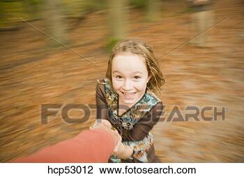 Stock Photo - girl twirling 
in the woods. 
fotosearch - search 
stock photos, 
pictures, images, 
and photo clipart