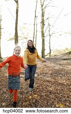 Stock Photo - mother and daughter 
running in woods. 
fotosearch - search 
stock photos, 
pictures, images, 
and photo clipart