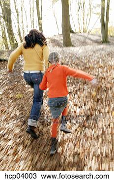 Stock Photo - mother and daughter 
running in woods. 
fotosearch - search 
stock photos, 
pictures, images, 
and photo clipart