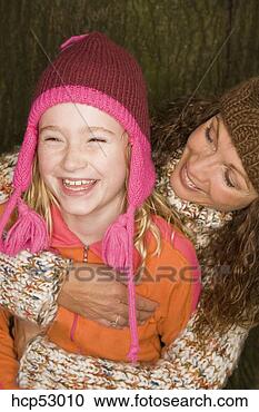Stock Photography - mother and daughter 
in winter hats. 
fotosearch - search 
stock photos, 
pictures, images, 
and photo clipart