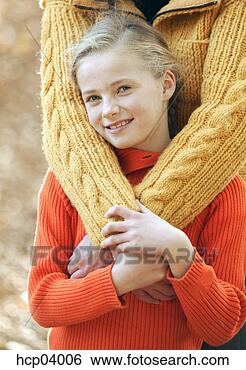 Stock Photo - mother hugging 
daughter. fotosearch 
- search stock 
photos, pictures, 
images, and photo 
clipart