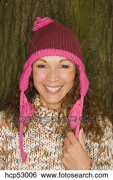 Stock Photo - woman wearing 
woolen hat and 
sweater. fotosearch 
- search stock 
photos, pictures, 
images, and photo 
clipart