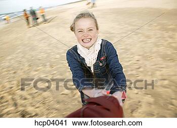 Stock Photography - young girl spinning. 
fotosearch - search 
stock photos, 
pictures, images, 
and photo clipart