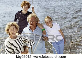 Stock Photo - family smiling 
on boat. fotosearch 
- search stock 
photos, pictures, 
images, and photo 
clipart