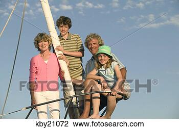 Stock Photo - family smiling 
on boat. fotosearch 
- search stock 
photos, pictures, 
images, and photo 
clipart