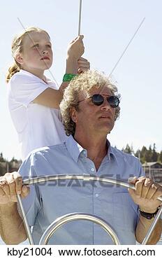 Stock Photo - father and daughter 
manning boat. 
fotosearch - search 
stock photos, 
pictures, images, 
and photo clipart