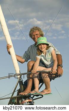 Stock Photography - father and daughter 
sitting on boat's 
edge. fotosearch 
- search stock 
photos, pictures, 
images, and photo 
clipart