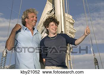 Stock Photo - father and son 
laughing on boat. 
fotosearch - search 
stock photos, 
pictures, images, 
and photo clipart