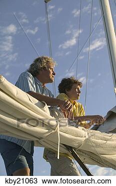 Stock Photo - father and son 
leaning on sail. 
fotosearch - search 
stock photos, 
pictures, images, 
and photo clipart