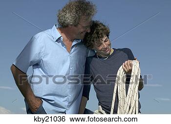 Stock Photo - father and son 
manning boat. 
fotosearch - search 
stock photos, 
pictures, images, 
and photo clipart