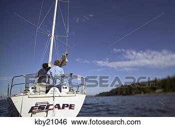 Stock Photo - father and son 
manning boat. 
fotosearch - search 
stock photos, 
pictures, images, 
and photo clipart