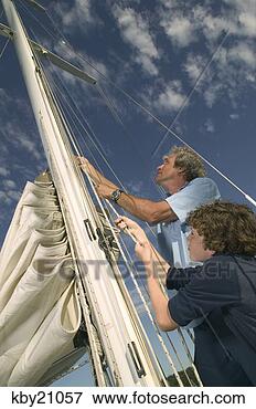 Picture - father and son 
raising sail. 
fotosearch - search 
stock photos, 
pictures, images, 
and photo clipart