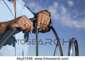 Stock Photo - man steering boat. 
fotosearch - search 
stock photos, 
pictures, images, 
and photo clipart