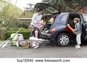 Stock Image - family packing 
car. fotosearch 
- search stock 
photos, pictures, 
images, and photo 
clipart