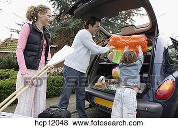 Stock Photo - family packing 
car. fotosearch 
- search stock 
photos, pictures, 
images, and photo 
clipart