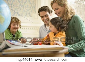 Stock Photo - family reading 
together. fotosearch 
- search stock 
photos, pictures, 
images, and photo 
clipart