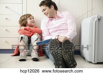 Stock Photo - father and son 
relaxing. fotosearch 
- search stock 
photos, pictures, 
images, and photo 
clipart